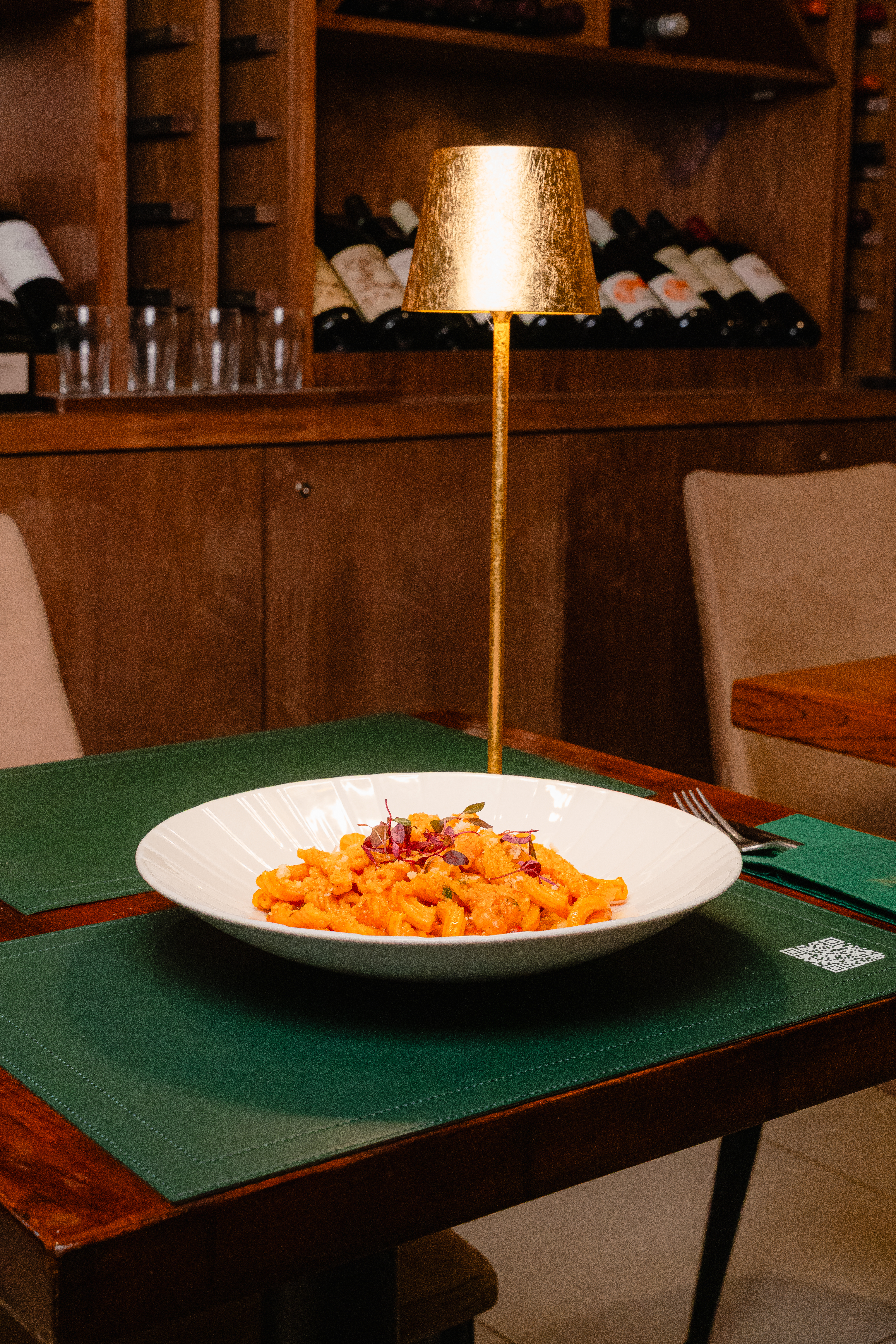 Pasta dish on a green table at Mate's