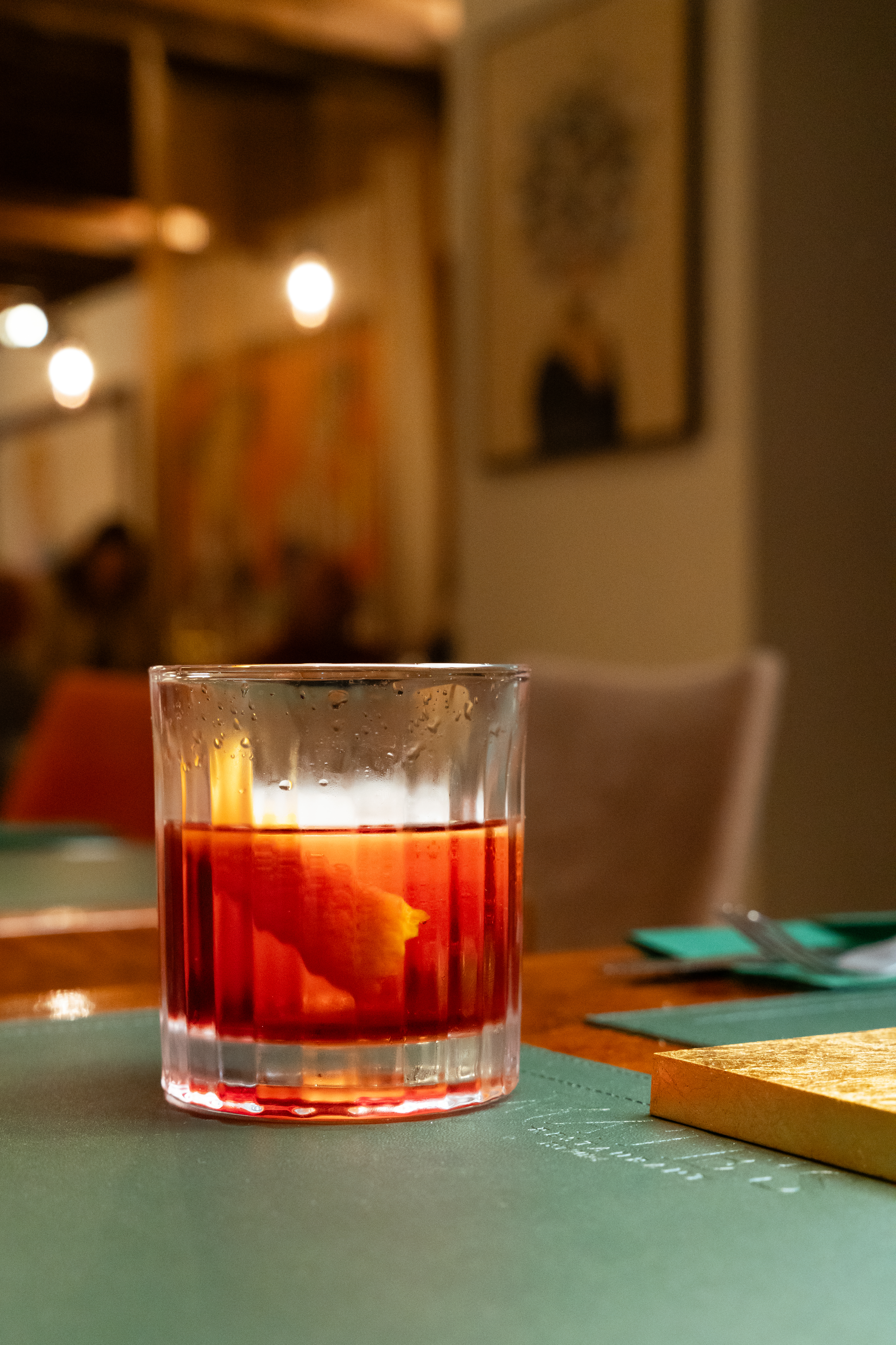 Negroni-style cocktail on a Mate's table